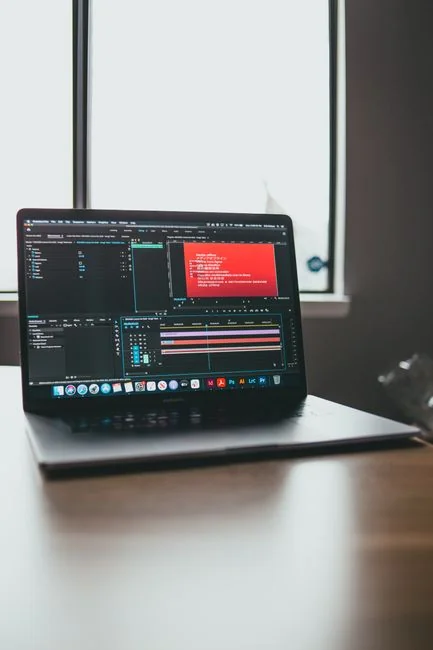A modern computer screen displaying web design work, showcasing creative visuals in a workspace.